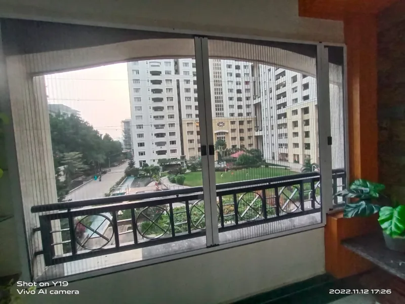 Front view of an existing balcony pleated-screen fitting.